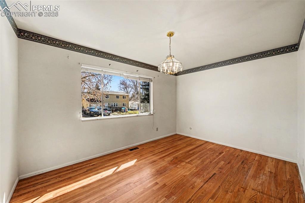 Primary Bedroom With Hardwood Flooring