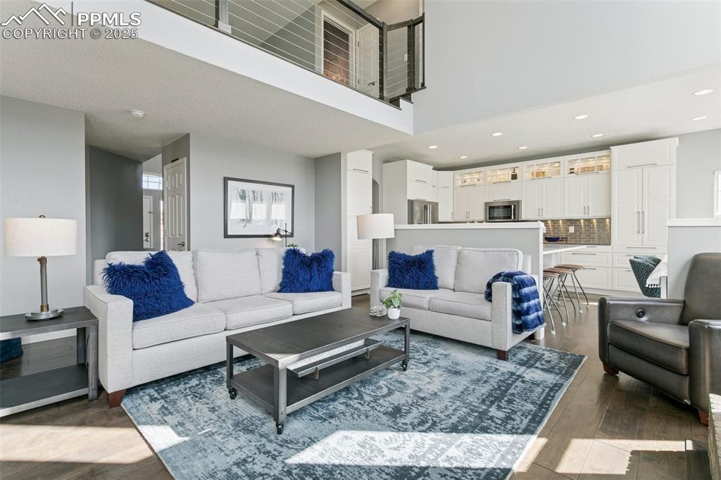 Main level family room with soaring ceilings and plenty of space for furniture placement!