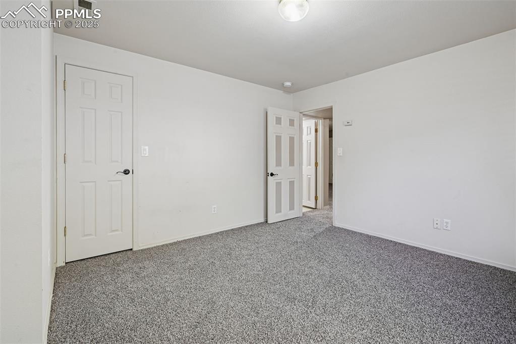 3rd bedroom - located in the basement - new carpet!