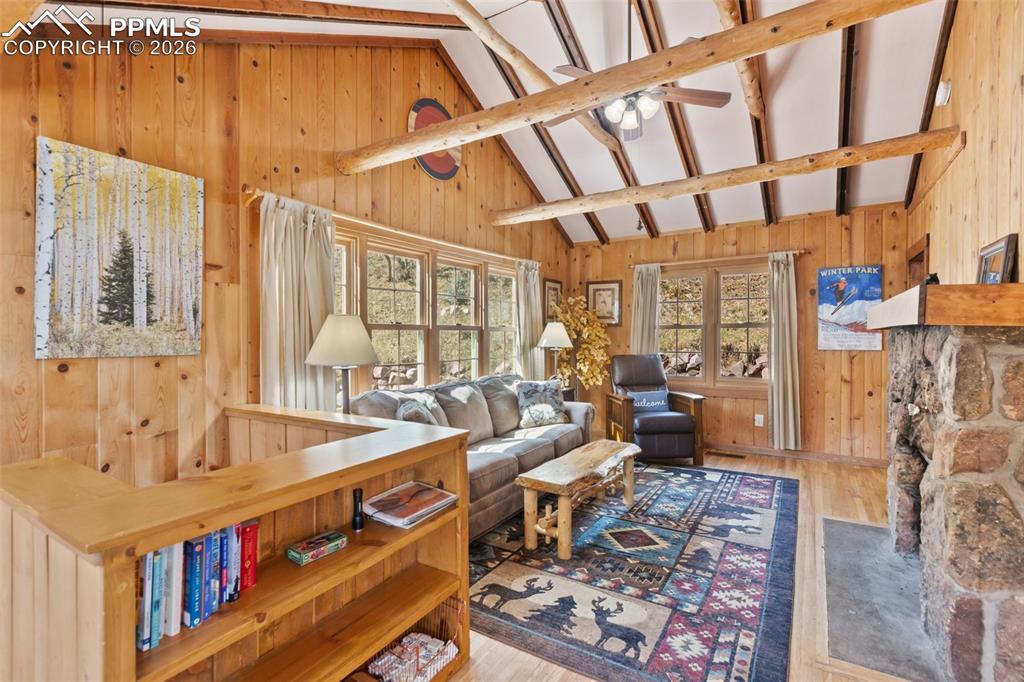 Living room with vaulted ceilings and beams