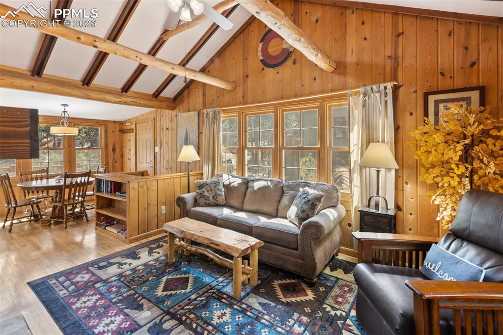 Living room with vaulted ceilings and beams