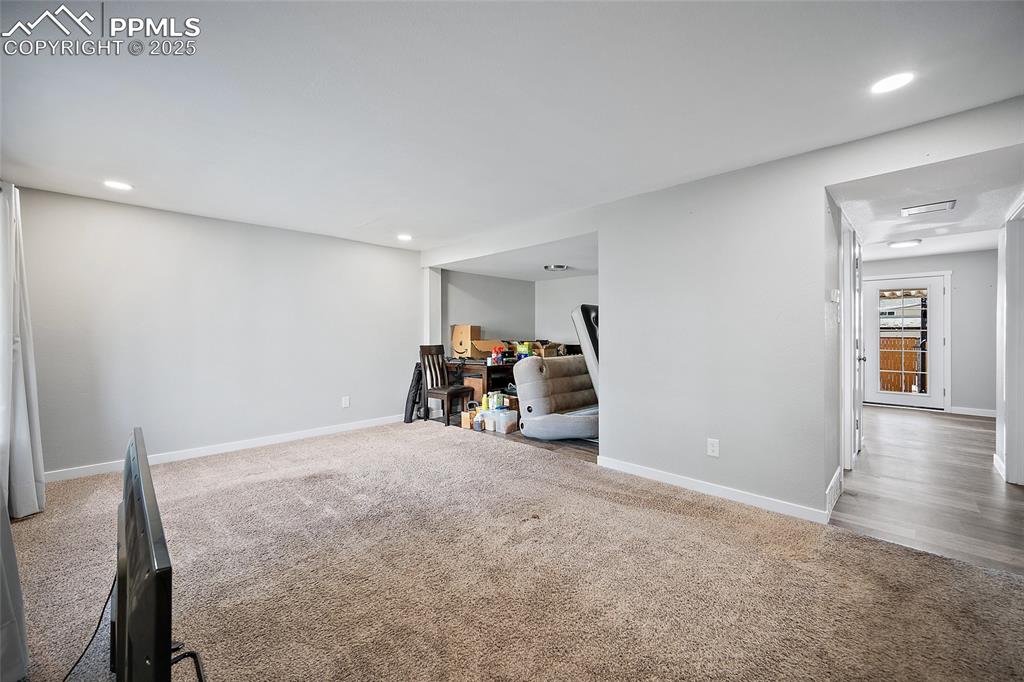 Playroom with light colored carpet and recessed lighting