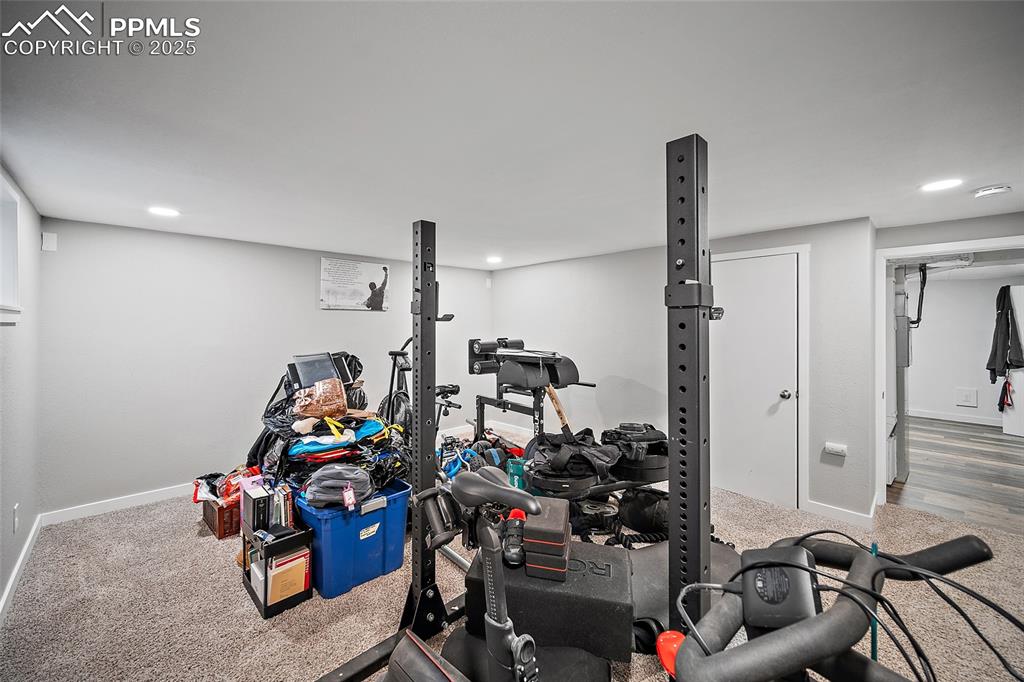 Exercise area with carpet floors and recessed lighting