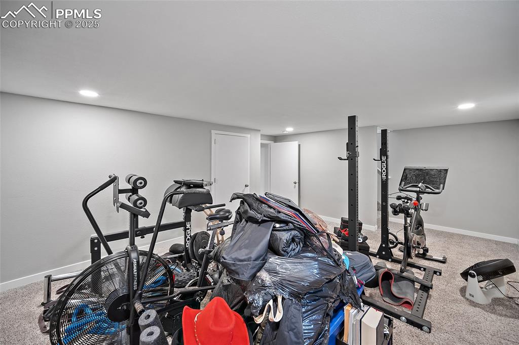 Workout room featuring carpet flooring and recessed lighting