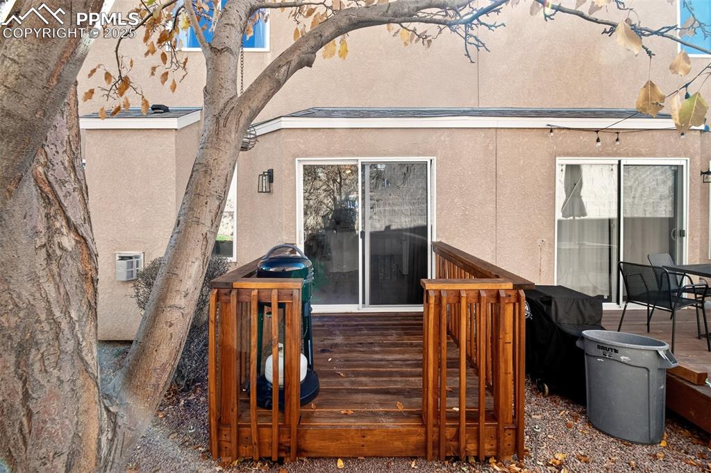 Back of house featuring a deck and stucco siding