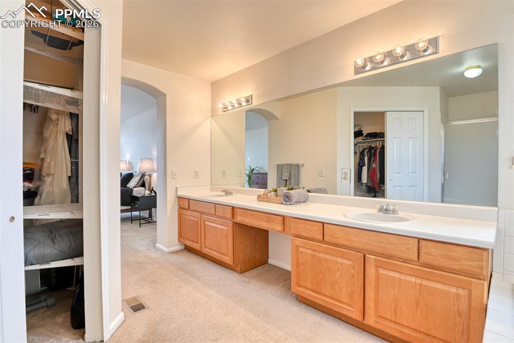 View from the shower area with walk-in closet on the left. 