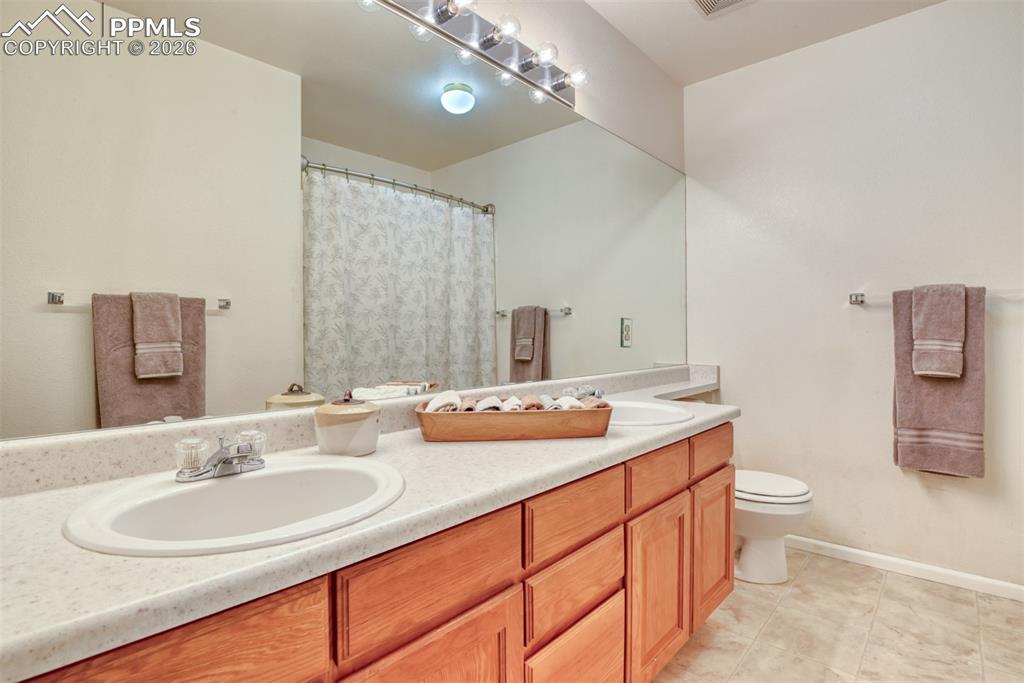 Upstairs hallway full bathroom located next to linen closet. 