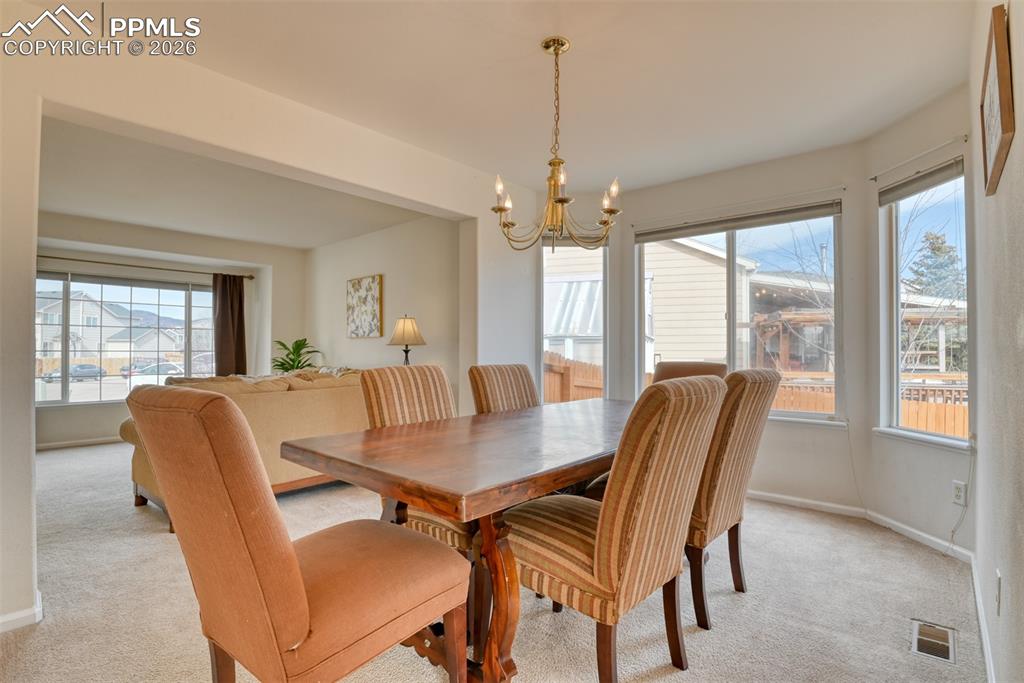 Large dining room  with large bay window