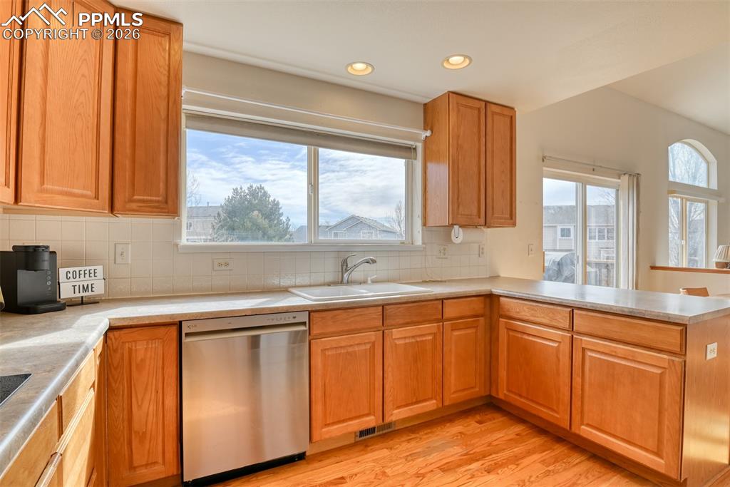 Kitchen walks out to back deck and has window overlooking the large backyard. 