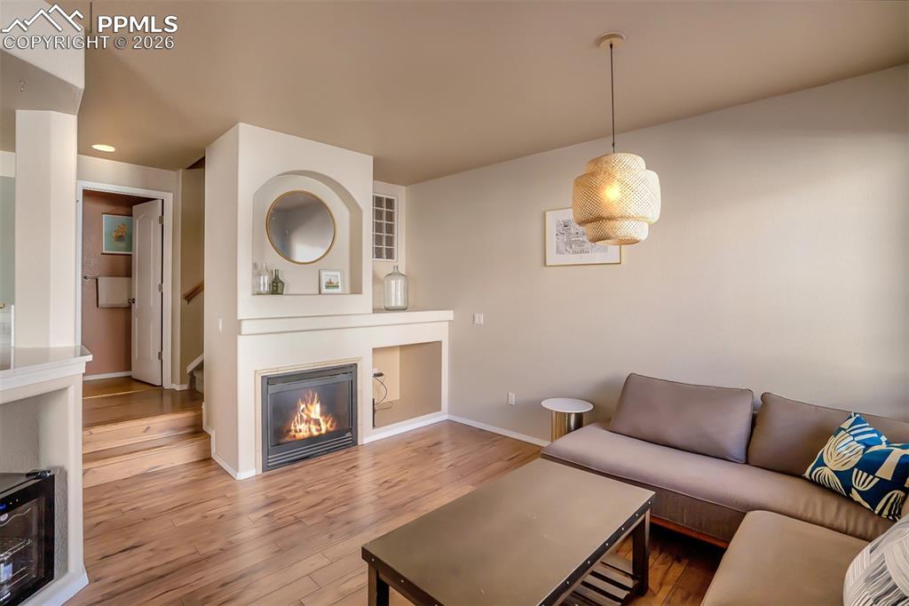 Gas fireplace and 1/2 Guest Bath at top of the 2 stairs.