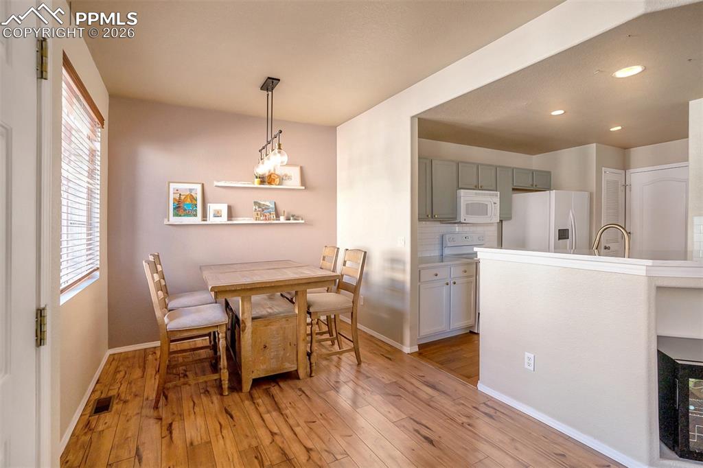 Dining area with newer light fixture. Luxury Vinyl flooring