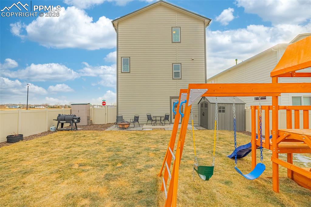 Spacious back yard with grass and mountain views