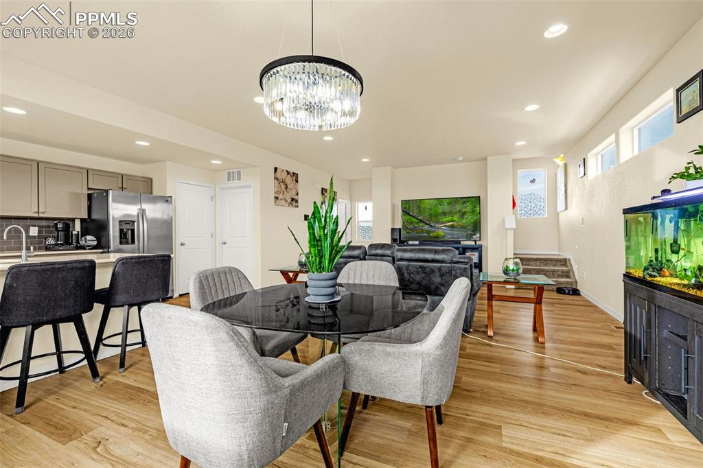 Open Dining area Seating looking into the family room and kitchen