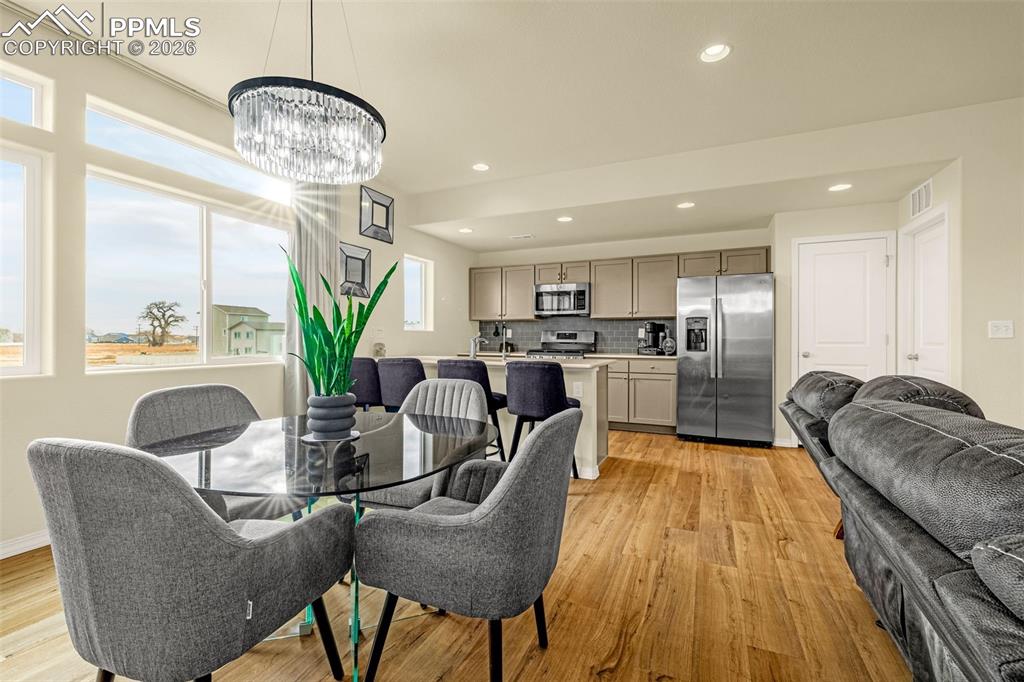 Dining room with automatic blinds great for natural light when company is over