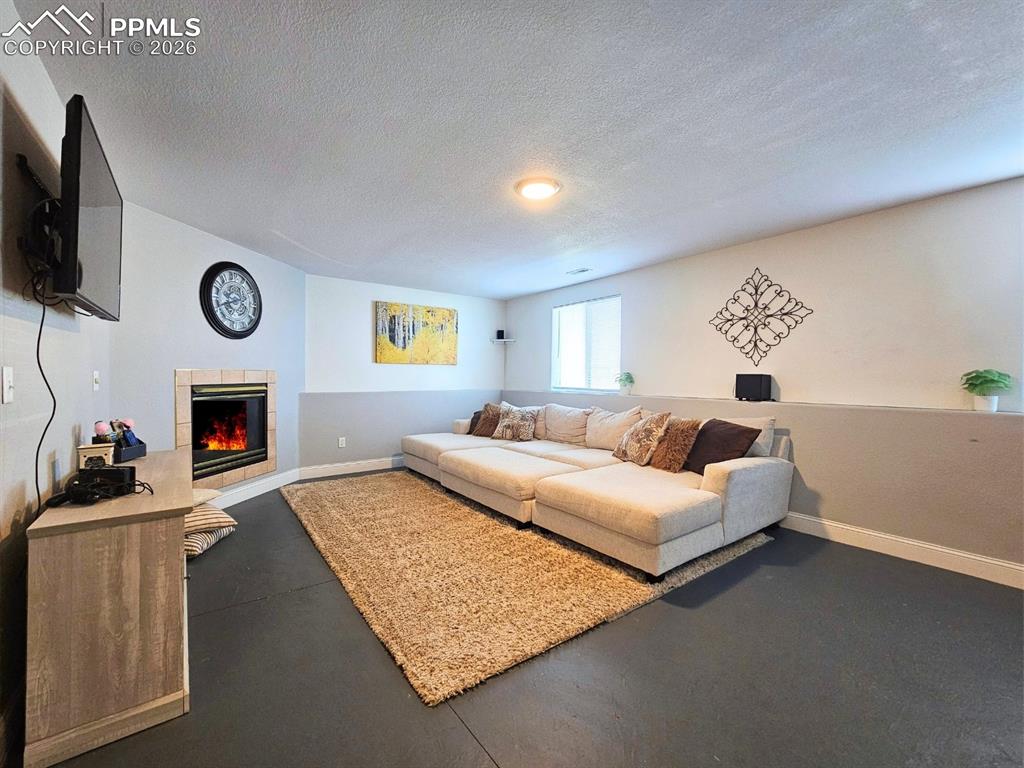 Large livingroom with a fireplace and reading nook - great for cold Colorado nights