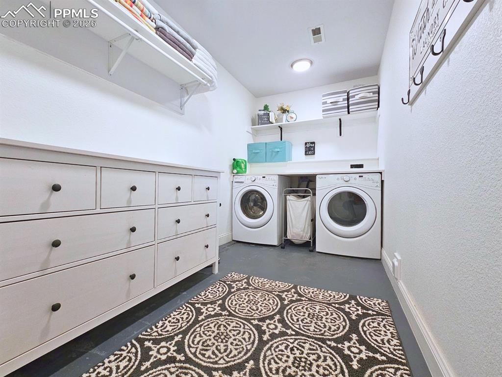 Spacious Laundry Room with Folding, Hanging and Storage