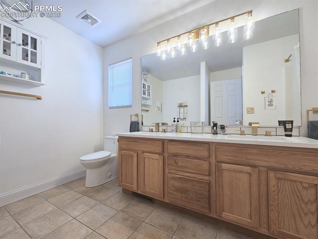 Spacious Dual Vanity Bathroom (2) with Quartz Countertops and Custom Finishes
