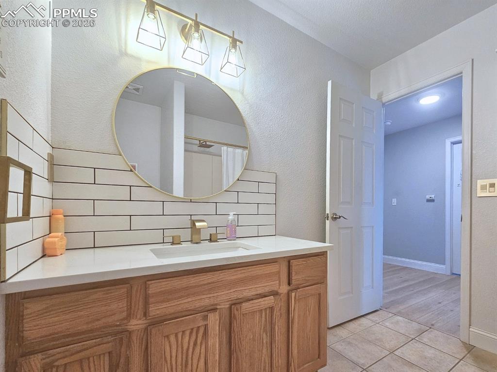 Custom backsplash and lighting, quartz countertops 