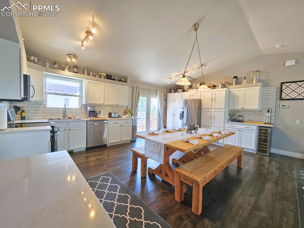 Kitchen with Quartz Countetops and plenty of prep stations, Plank Floor, A Wall Pantry - Oversized and Deep,