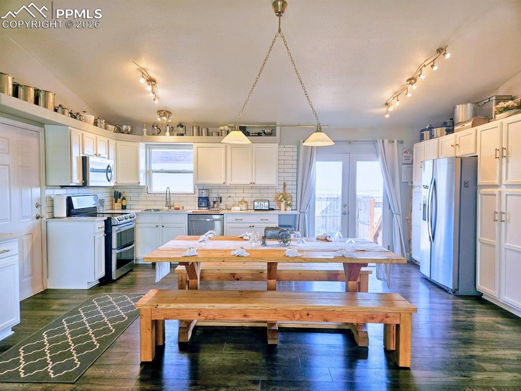The heart of the house - The kitchen with it's farmhouse sink and custom pull-outs in the deep cabinets 