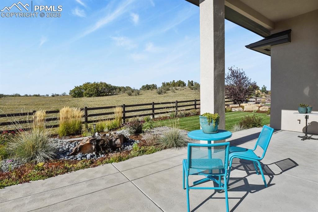 Enjoy the peaceful private backyard that backs to open space and has a calming water feature 
