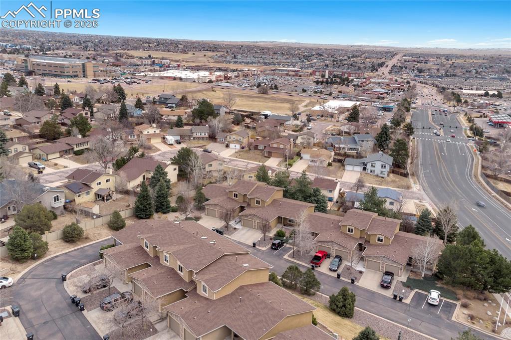 Aerial view of property's location featuring nearby suburban area