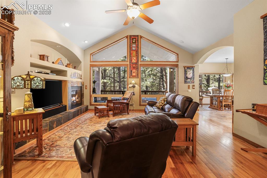 Living room with vaulted ceiling and hardwood floor