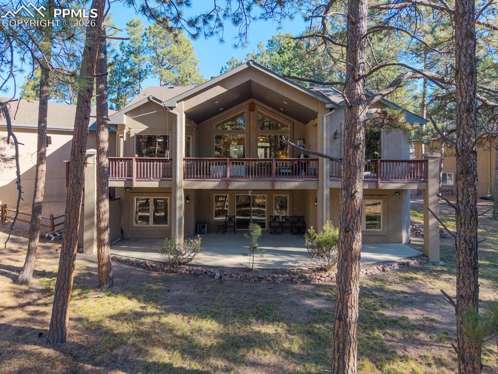 Full-width deck and patio on back side