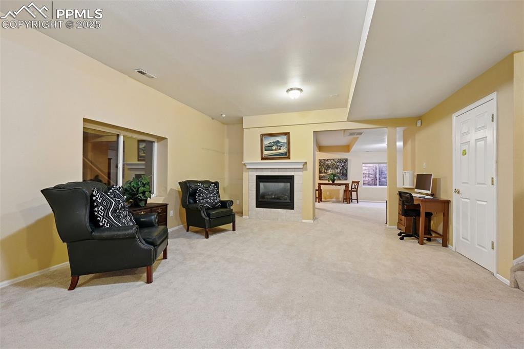 Basement family room with large additional area and fireplace