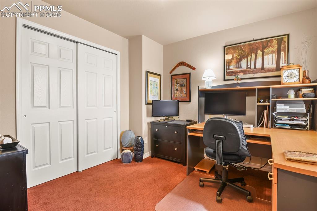 Second Bedroom on the main level, current used as an office.  Large closet. Carpet.
