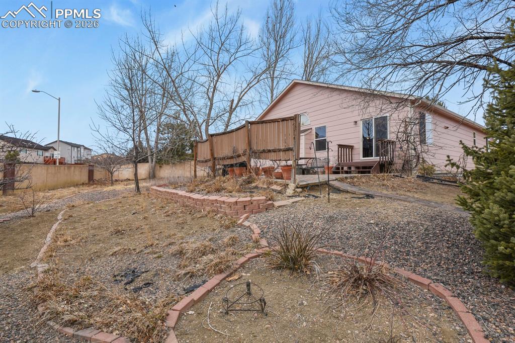 View of the back of the home from the backyard.