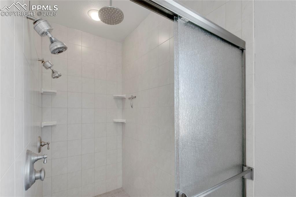 Bathroom with a tile shower