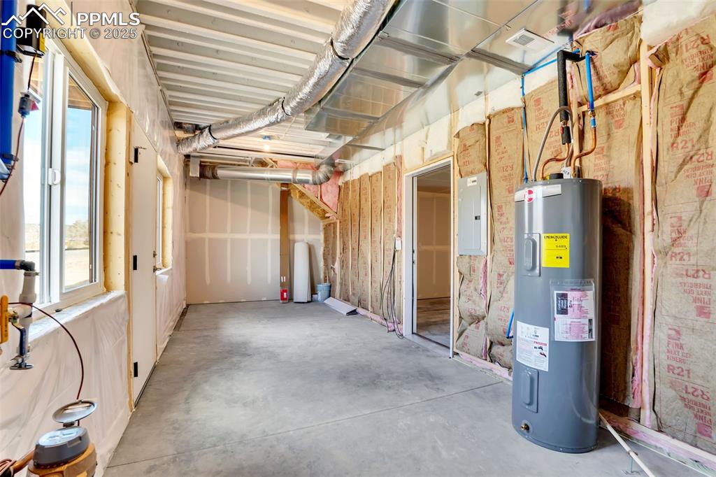 Unfinished storage/mechanical and laundry off of garage.