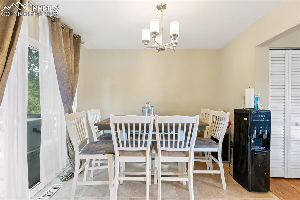 Dining area with a chandelier