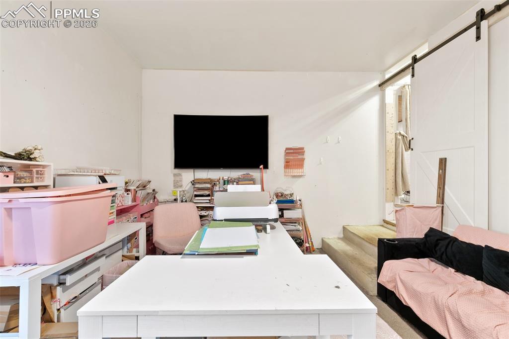 Office area featuring a barn door