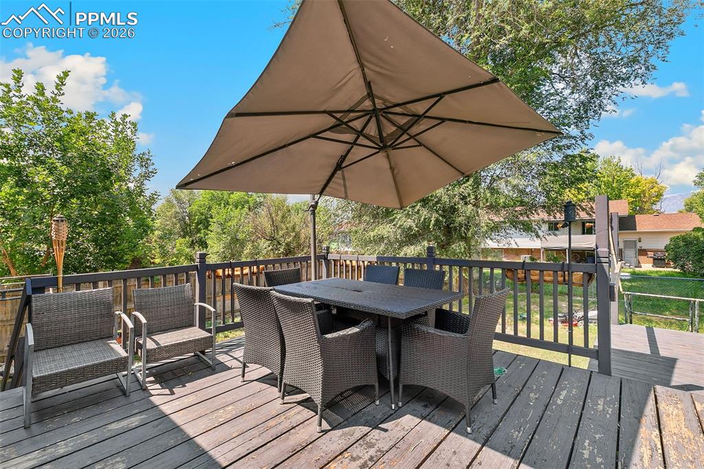 Wooden terrace featuring outdoor dining space