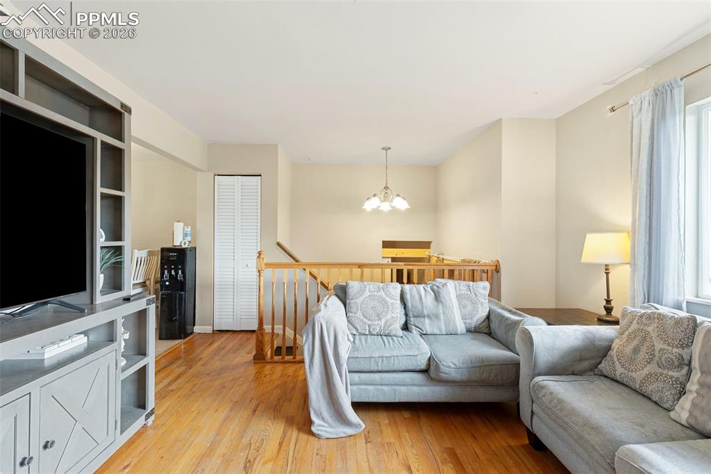 Living area featuring a chandelier and light wood finished floors