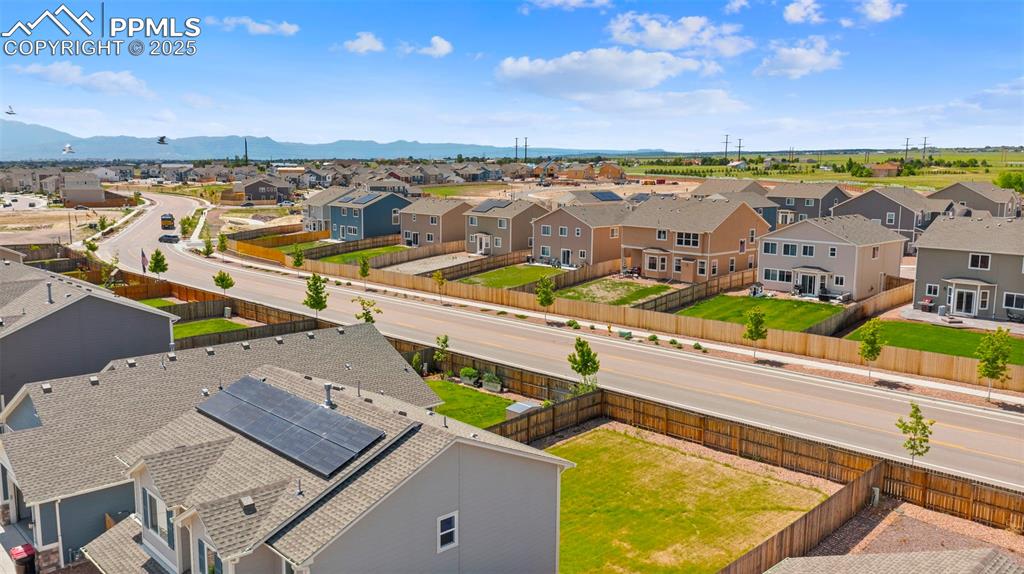 Aerial view of residential area with a mountainous background