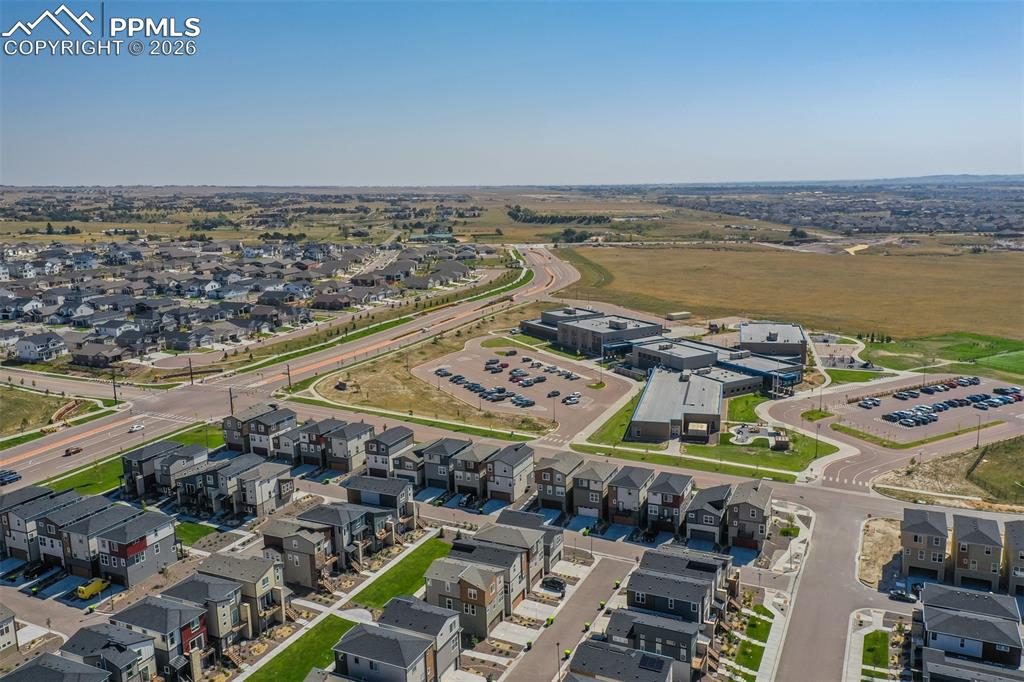 Aerial overview of property's location featuring nearby suburban area