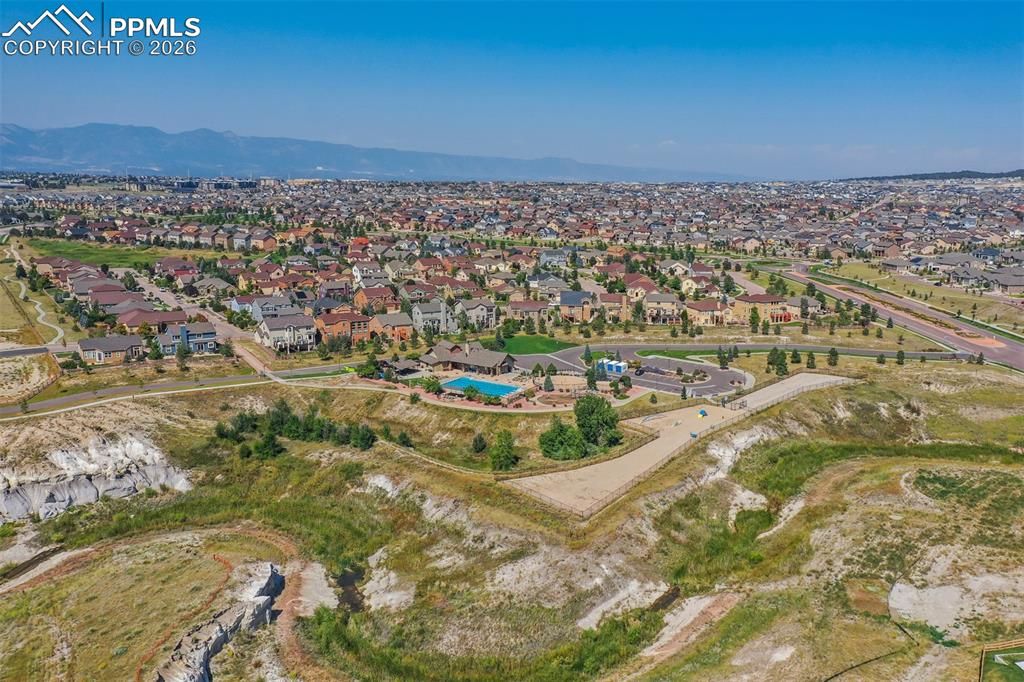 Aerial view of residential area featuring a mountainous background