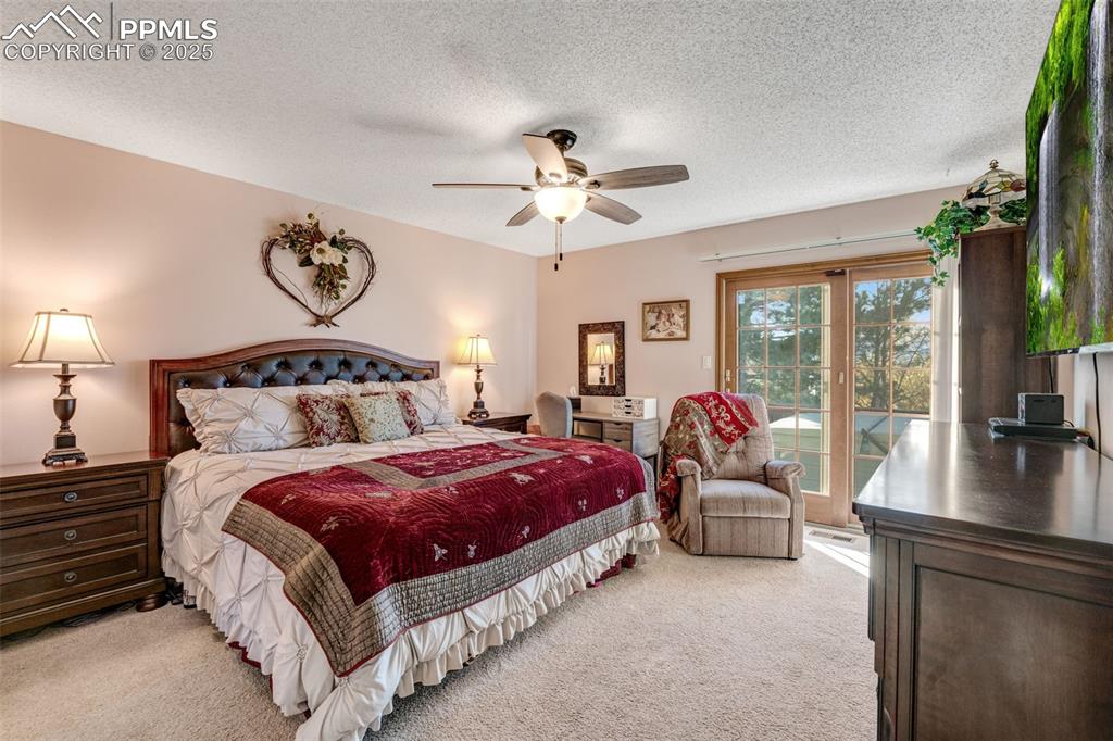 Primary bedroom with private deck and hot tub.