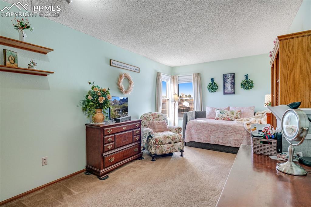 2nd story bedroom featuring unobscured mountain views from the corner windows.