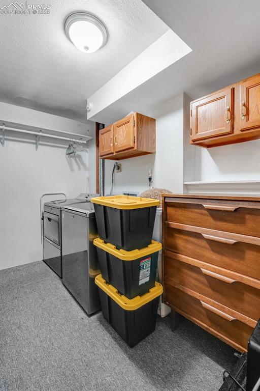 Spacious laundry room with storage and laundry chute from primary closet. 