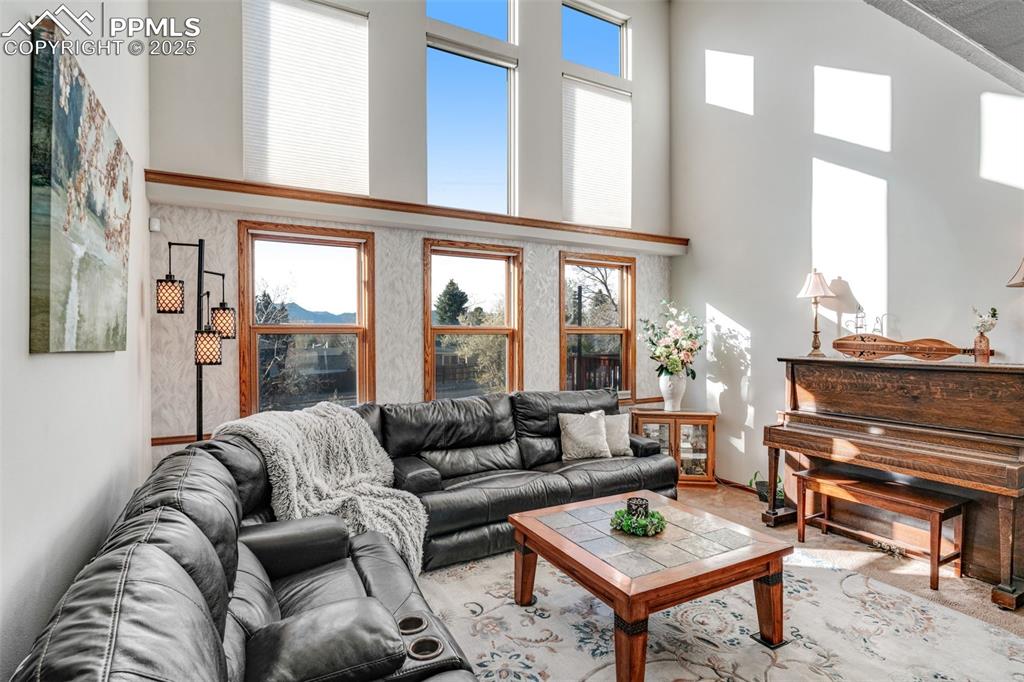 Formal living area featuring a towering ceiling and two-story windows!