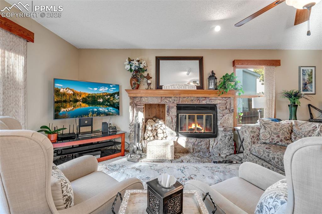 Cozy living room with wood burning fireplace. 