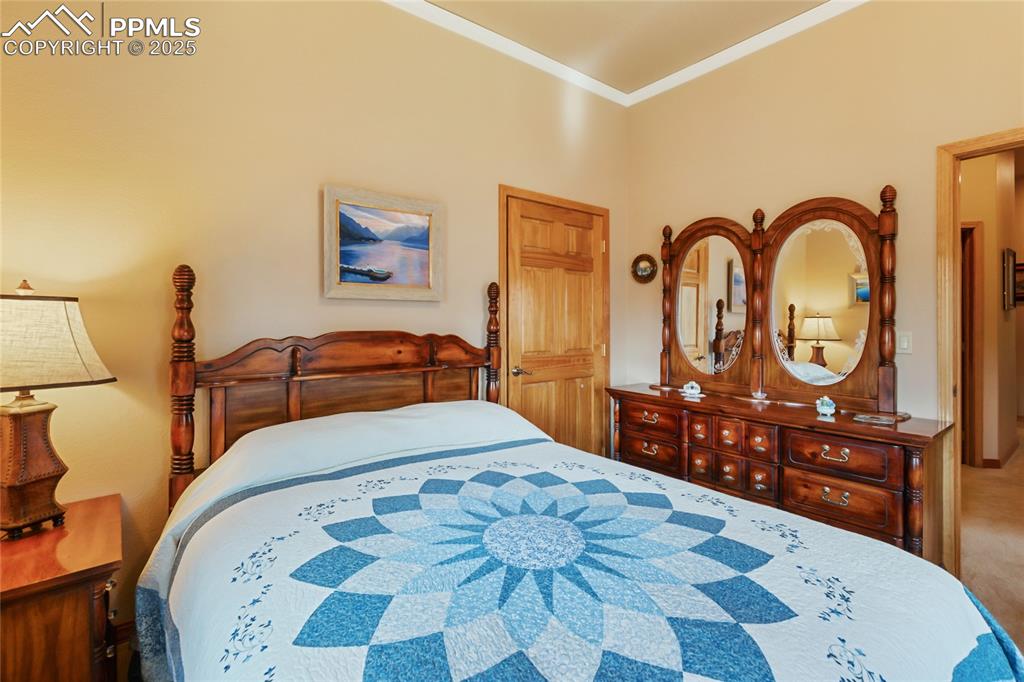 Bedroom featuring crown molding.