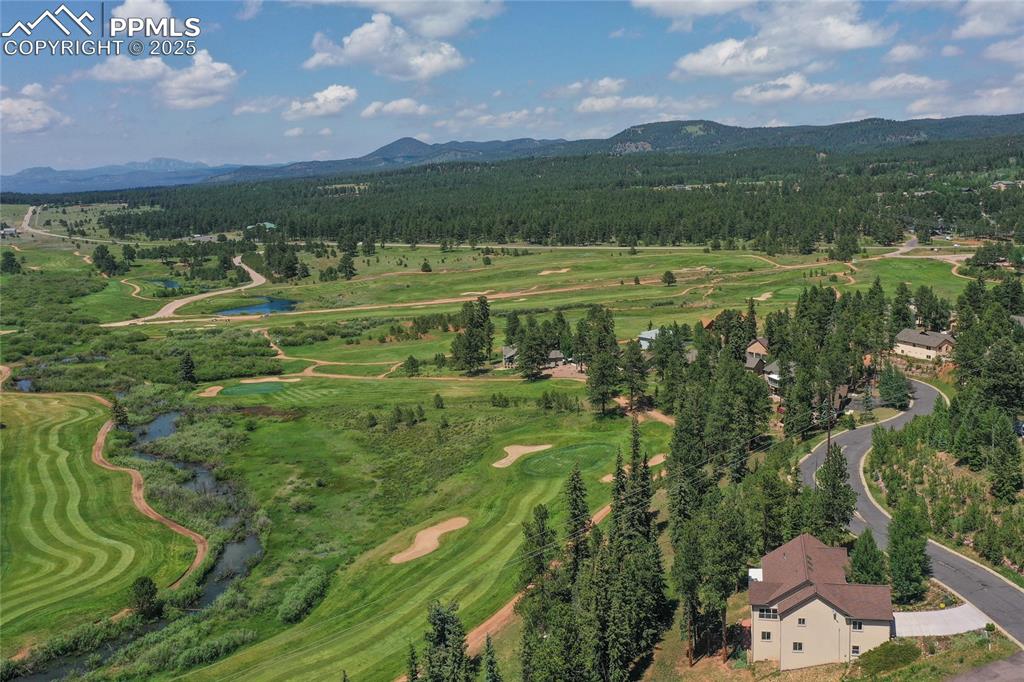 Aerial view of a club and mountain view. 