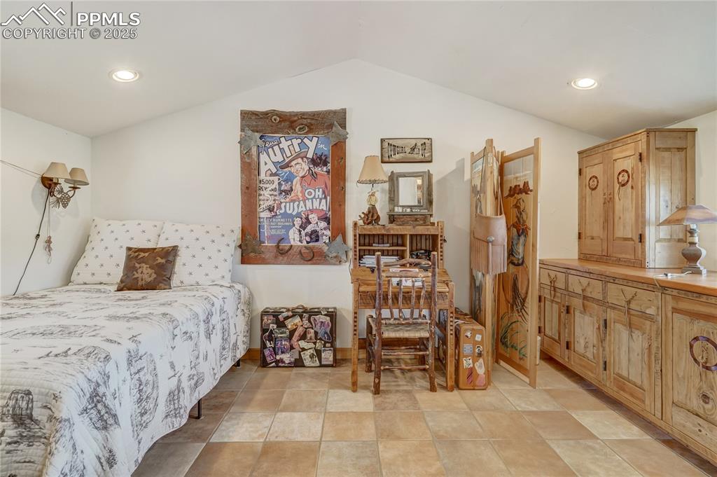 Bedroom with recessed lighting and vaulted ceiling