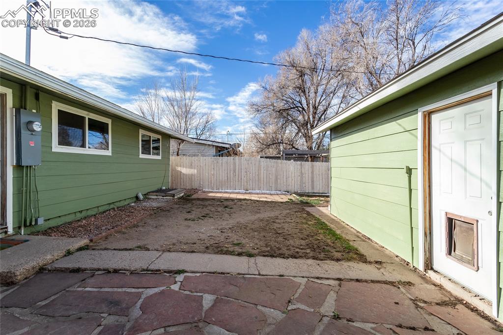 Patio, yard, all enclosed with new fencing.