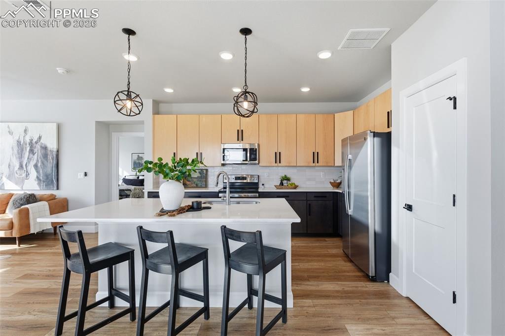Enjoy the spacious upgraded kitchen with lots of work space or enjoy the breakfast bar area for homework, connecting with friends, etc. 